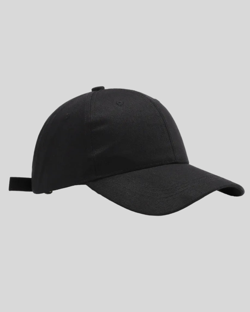 CoreForm Essential Cap in black front angle view with structured crown and curved brim