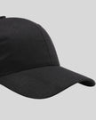CoreForm Essential Cap in black right side close-up highlighting curved brim and panel structure
