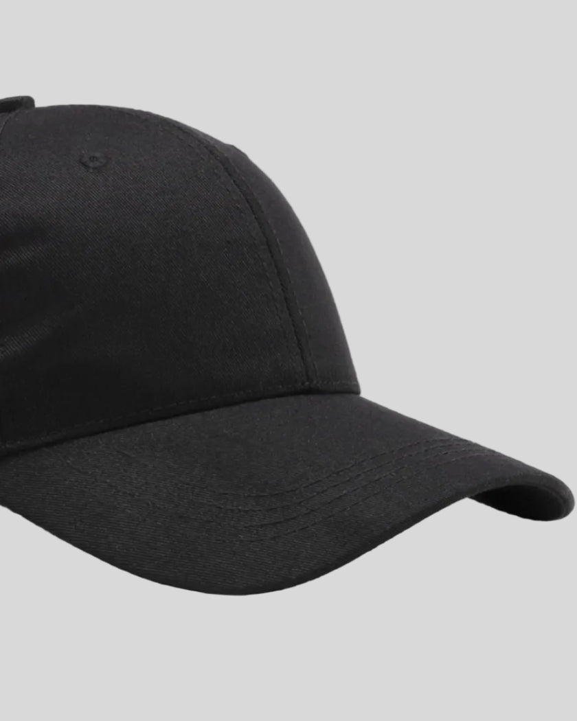 CoreForm Essential Cap in black right side close-up highlighting curved brim and panel structure