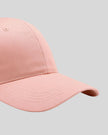 CoreForm Essential Cap in blush pink right side close-up highlighting curved brim and panel structure