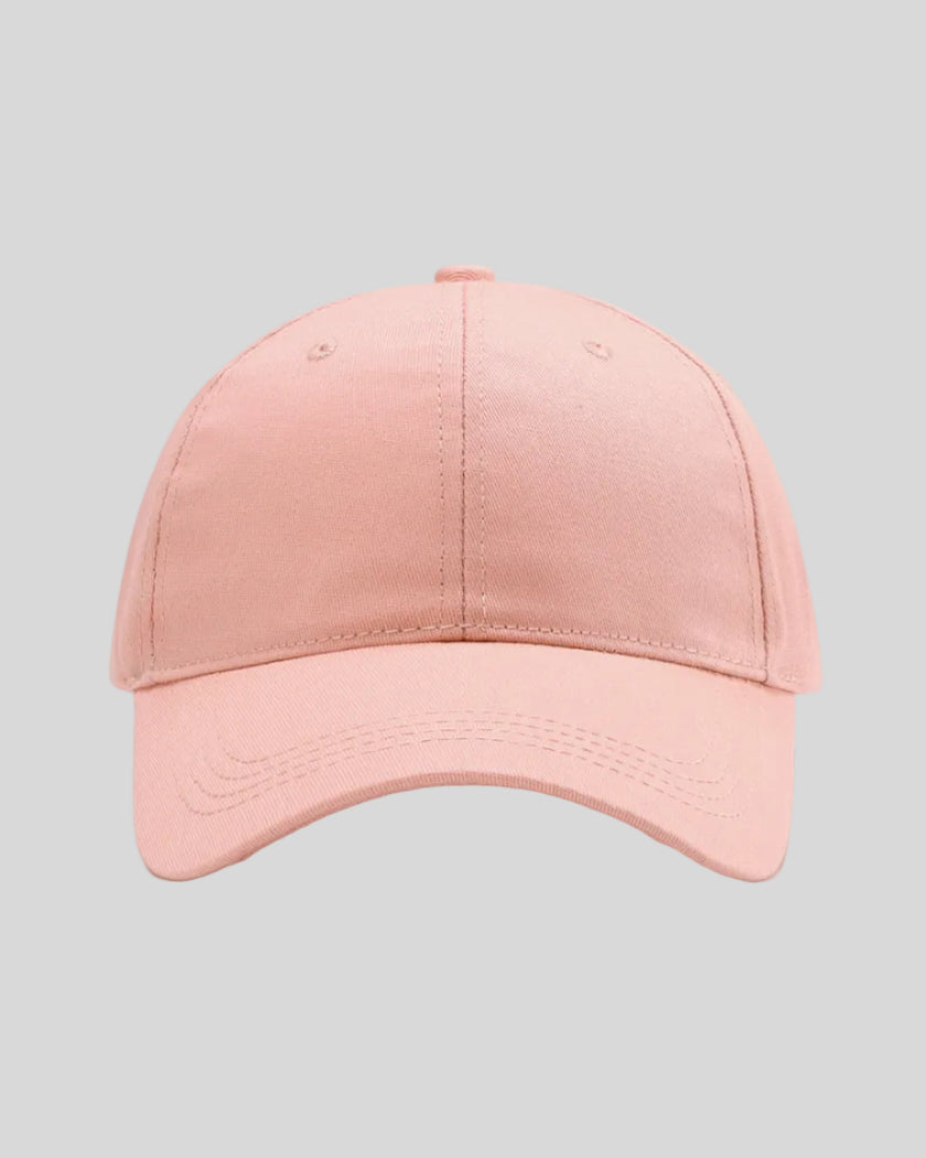 CoreForm Essential Cap in blush pink front view with structured crown and curved brim