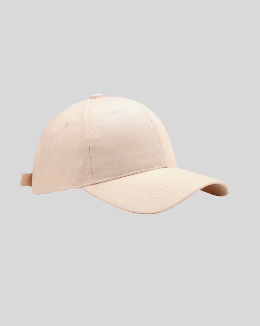 CoreForm Essential Cap in cream front angle view with structured crown and curved brim