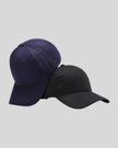 CoreForm Essential Cap in dark blue and black front angle view with structured crown and curved brim