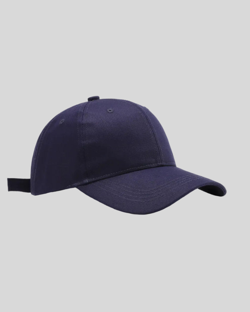 CoreForm Essential Cap in dark blue front angle view with structured crown and curved brim