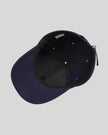 CoreForm Essential Cap in dark blue inside view showing internal structure and seams