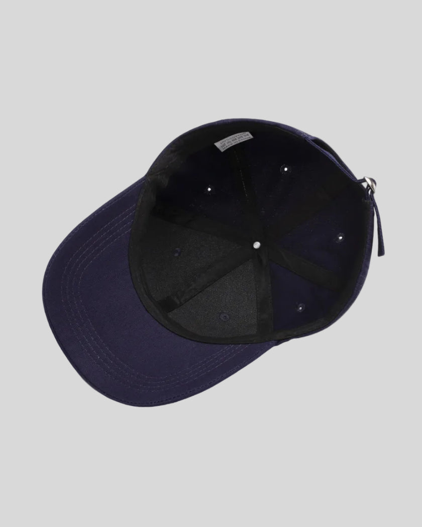 CoreForm Essential Cap in dark blue inside view showing internal structure and seams