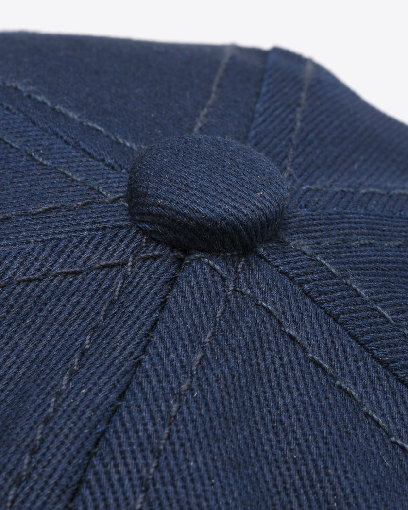 CoreForm Essential Cap in dark blue top exterior close-up showing stitching and fabric texture