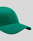CoreForm Essential Cap in dark green right side close-up highlighting curved brim and panel structure