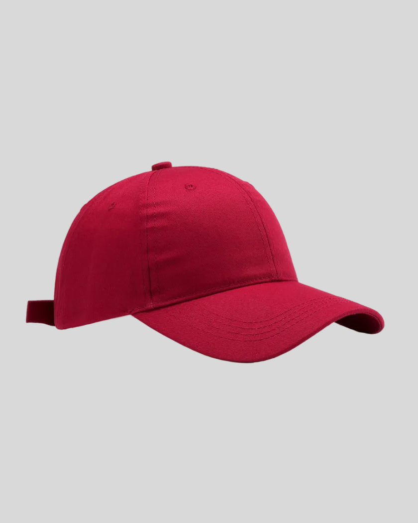 CoreForm Essential Cap in red front angle view with structured crown and curved brim