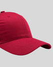 CoreForm Essential Cap in red right side close-up highlighting curved brim and panel structure
