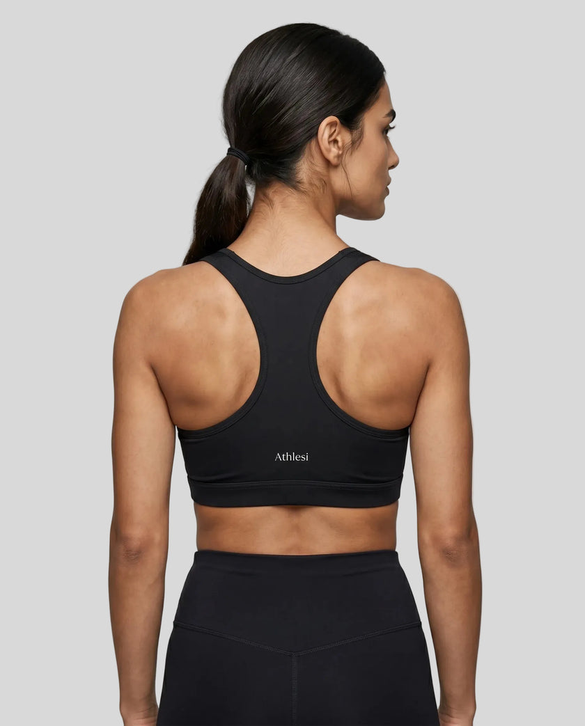 CoreForm Sports Bra in black, back view styled on model