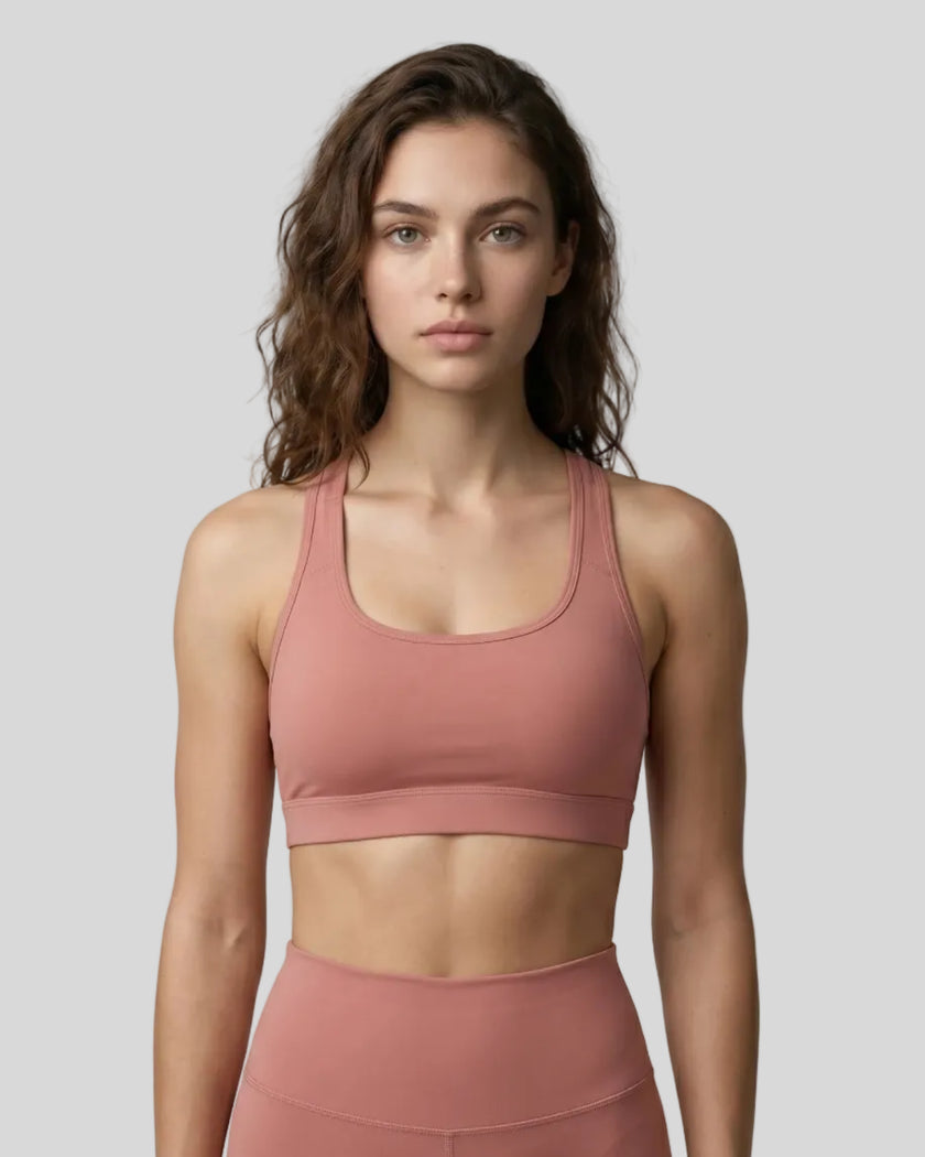 CoreForm Sports Bra in brick red, front view styled on model