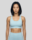 CoreForm Sports Bra in sky blue, front view styled on model