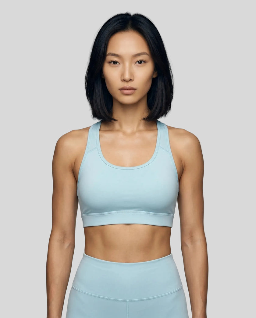 CoreForm Sports Bra in sky blue, front view styled on model
