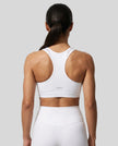 CoreForm Sports Bra in white, back view styled on model