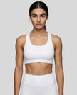 CoreForm Sports Bra in white, front view styled on model