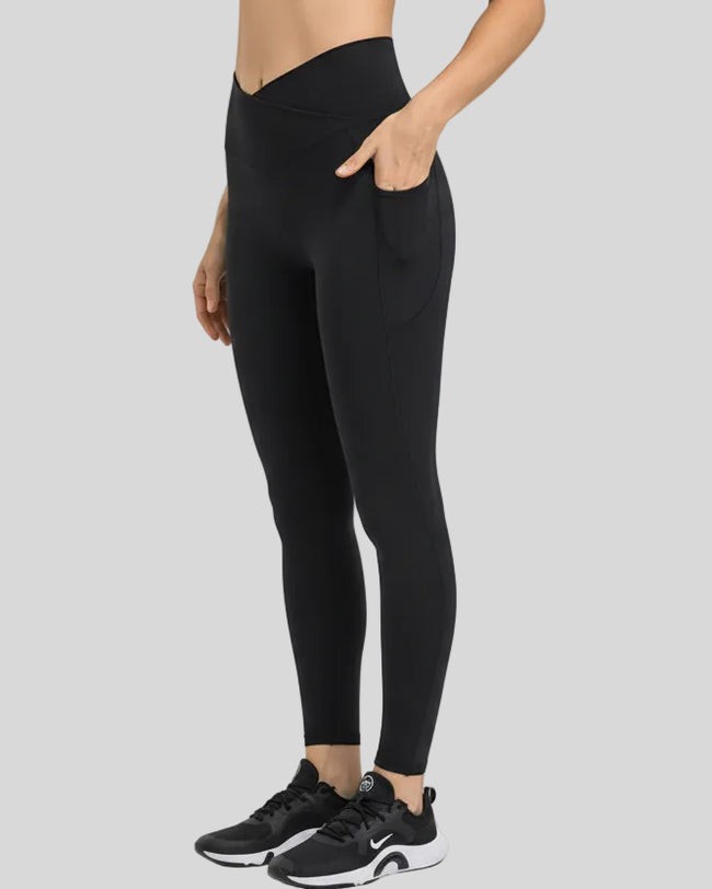 Side view showing the sleek profile and pocket placement of the CoreLift V-Waist Pocket Legging in Black