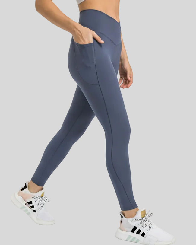 Side view showing the sleek profile and pocket placement of the CoreLift V-Waist Pocket Legging in French Blue
