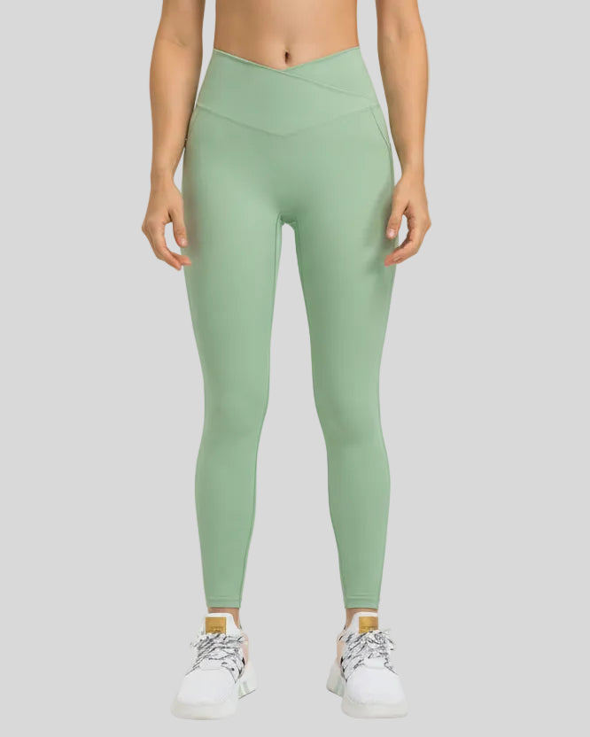 Front view of Athlesi CoreLift V-Waist Pocket Legging in Gum Leaf with sculpting V-waist design