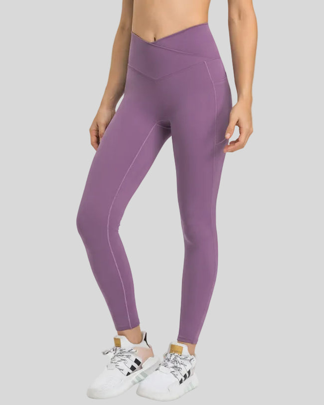 Front view of Athlesi CoreLift V-Waist Pocket Legging in Mauve with sculpting V-waist design