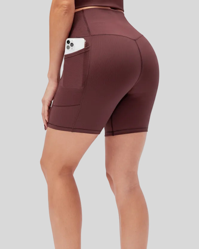 Athlesi CoreLift V-waist pocket short in burgundy, back angle view