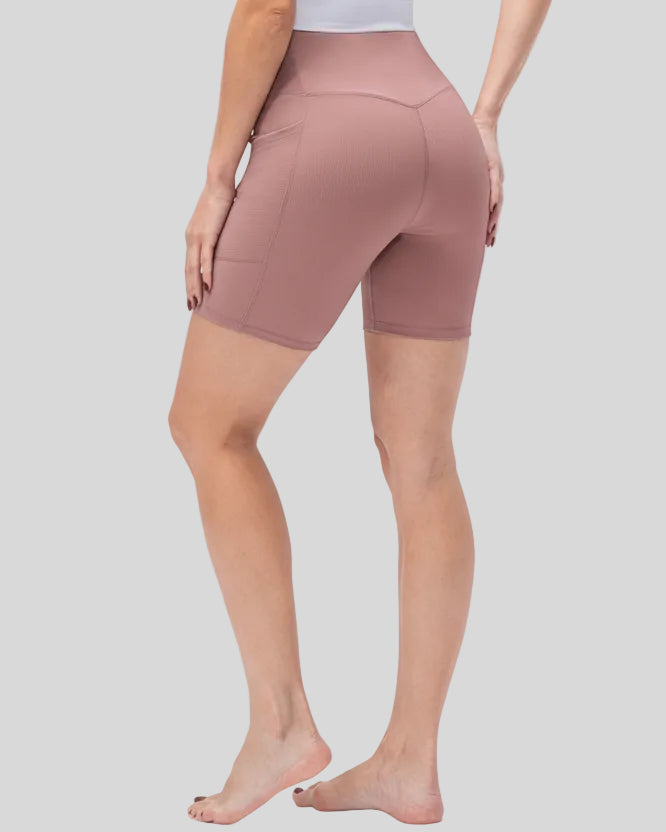 Athlesi CoreLift V-waist pocket short in dusty pink, back angle view