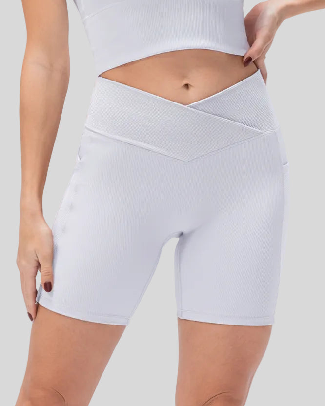 Athlesi CoreLift V-waist pocket short in white, front view