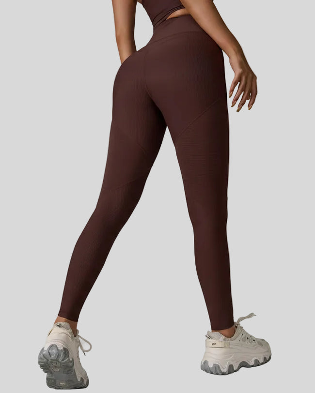 Back angled view of ribbed legging with V-waist detail in brown