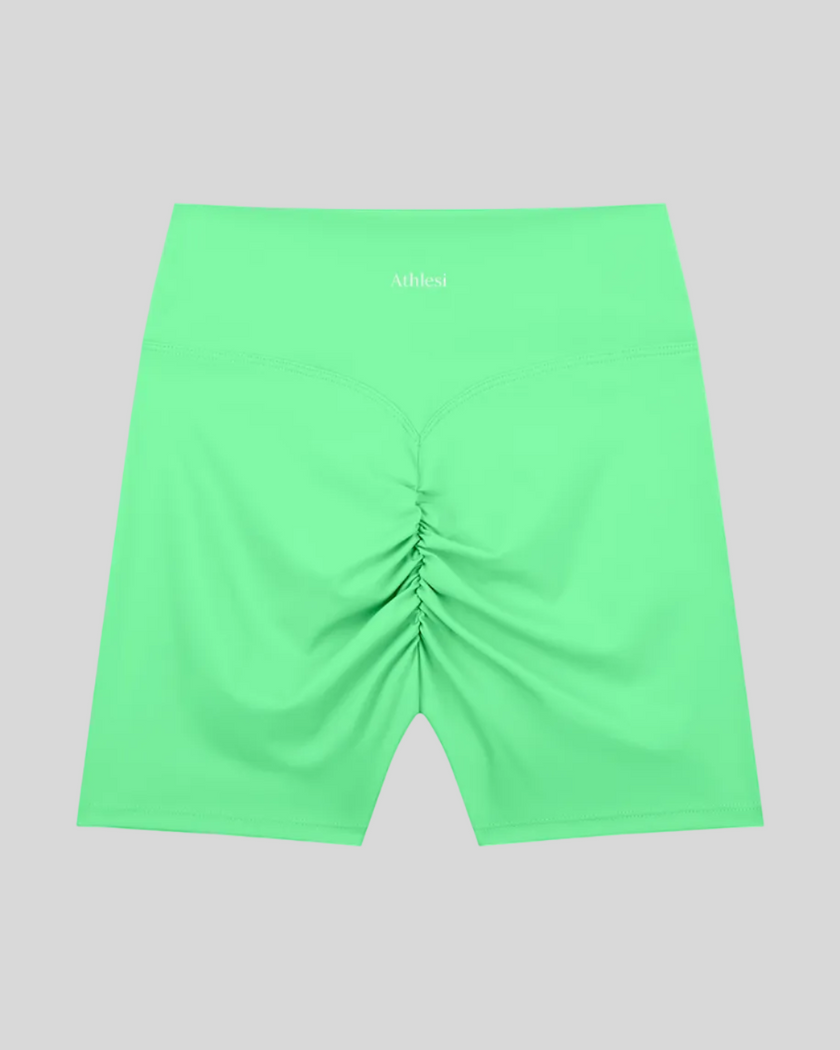 CoreLine Biker Shorts in green, flatlay back view