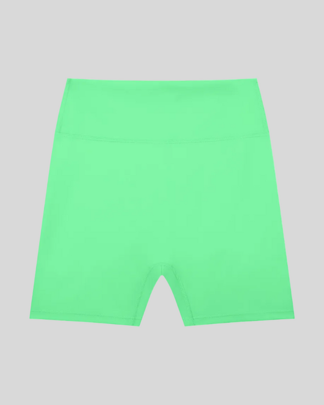 CoreLine Biker Shorts in green, flatlay front view