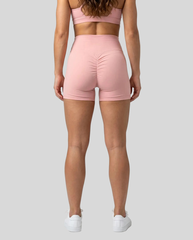 CoreLine Biker Shorts in pink, back view styled on model