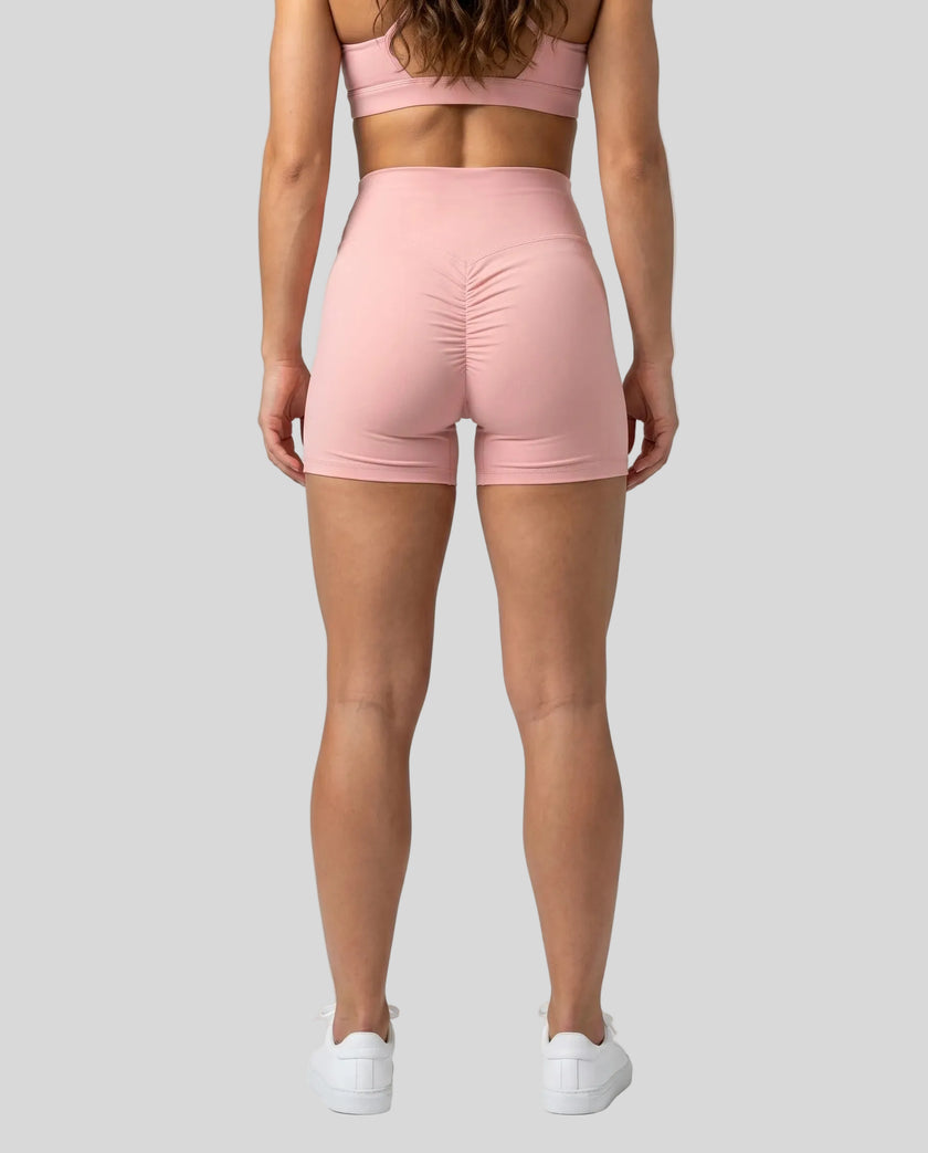 CoreLine Biker Shorts in pink, back view styled on model