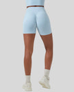 CoreLine Biker Shorts in sky blue, lower body back view