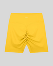 CoreLine Biker Shorts in yellow, flatlay back view