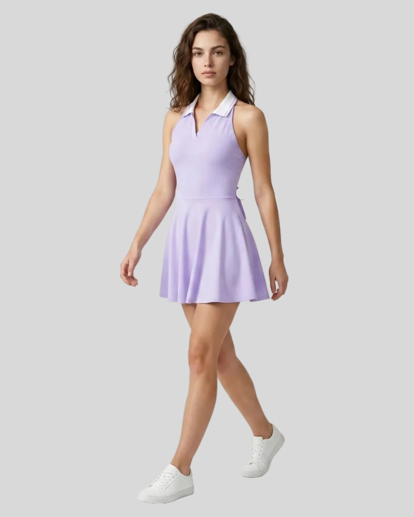 Model wearing purple Athlesi CoreLine court dress front angle