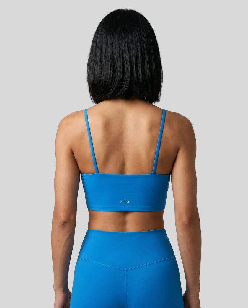 CoreLine Sports Bra in colorful blue, back view styled on model