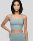 CoreLine Sports Bra in haze blue, front angle close-up styled with matching leggings