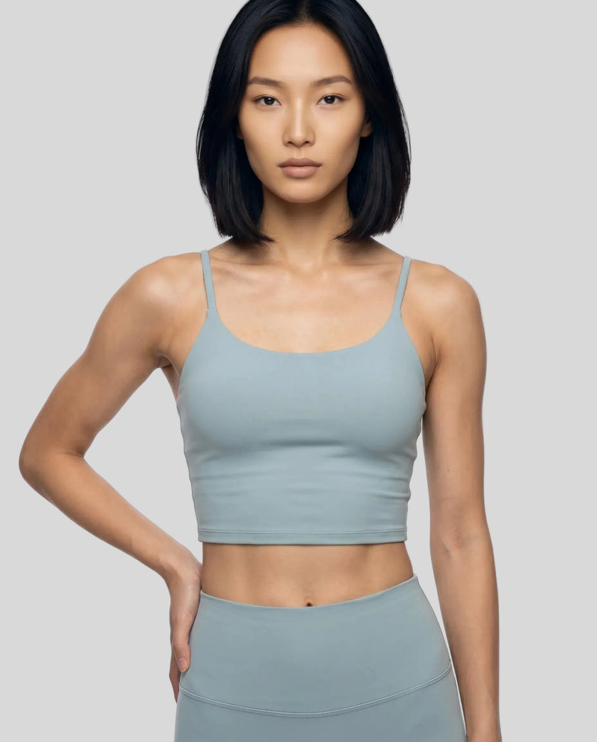 CoreLine Sports Bra in haze blue, front angle close-up styled with matching leggings