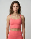 CoreLine Sports Bra in rose pink, front view styled on model
