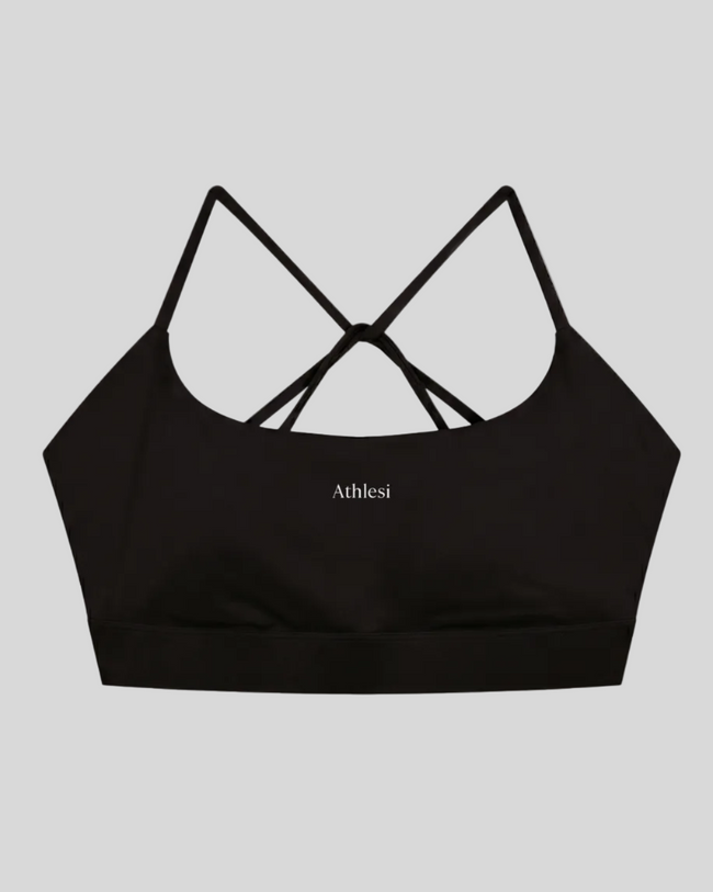 CoreLine Studio Sports Bra in black, flatlay front view with scoop neckline