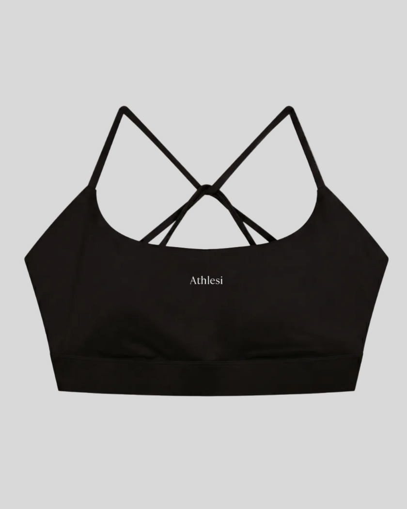 CoreLine Studio Sports Bra in black, flatlay front view with scoop neckline