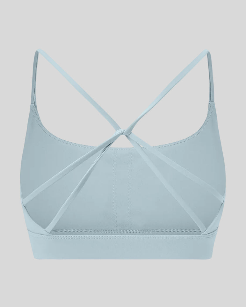 CoreLine Studio Sports Bra in light blue, 3D back view with strappy design
