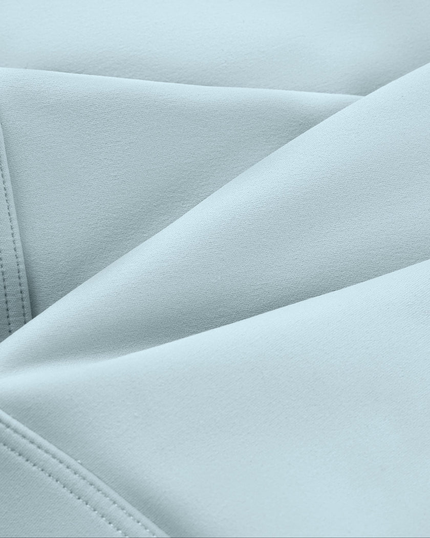 CoreLine Studio Sports Bra in light blue, fabric texture close-up