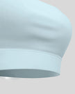 CoreLine Studio Sports Bra in light blue, underband detail close-up