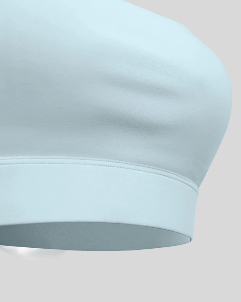 CoreLine Studio Sports Bra in light blue, underband detail close-up