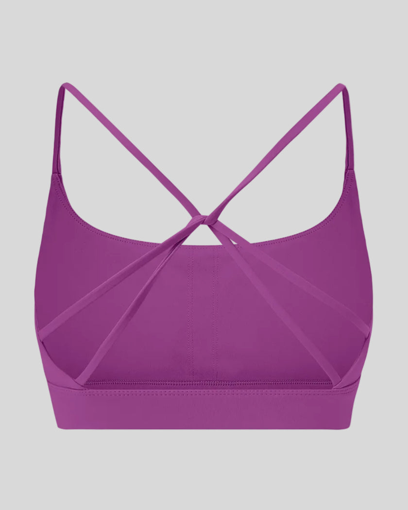 CoreLine Studio Sports Bra in purple, 3D back view with strappy design