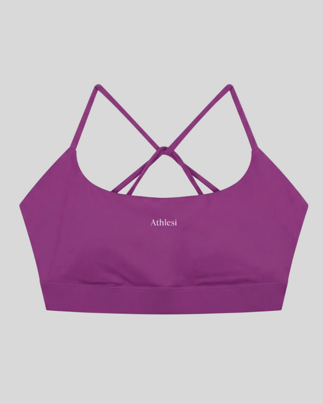 CoreLine Studio Sports Bra in purple, flatlay front view with scoop neckline