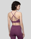 CoreLine Studio Sports Bra in purple, upper body angled back view