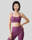 CoreLine Studio Sports Bra in purple, front view styled on model