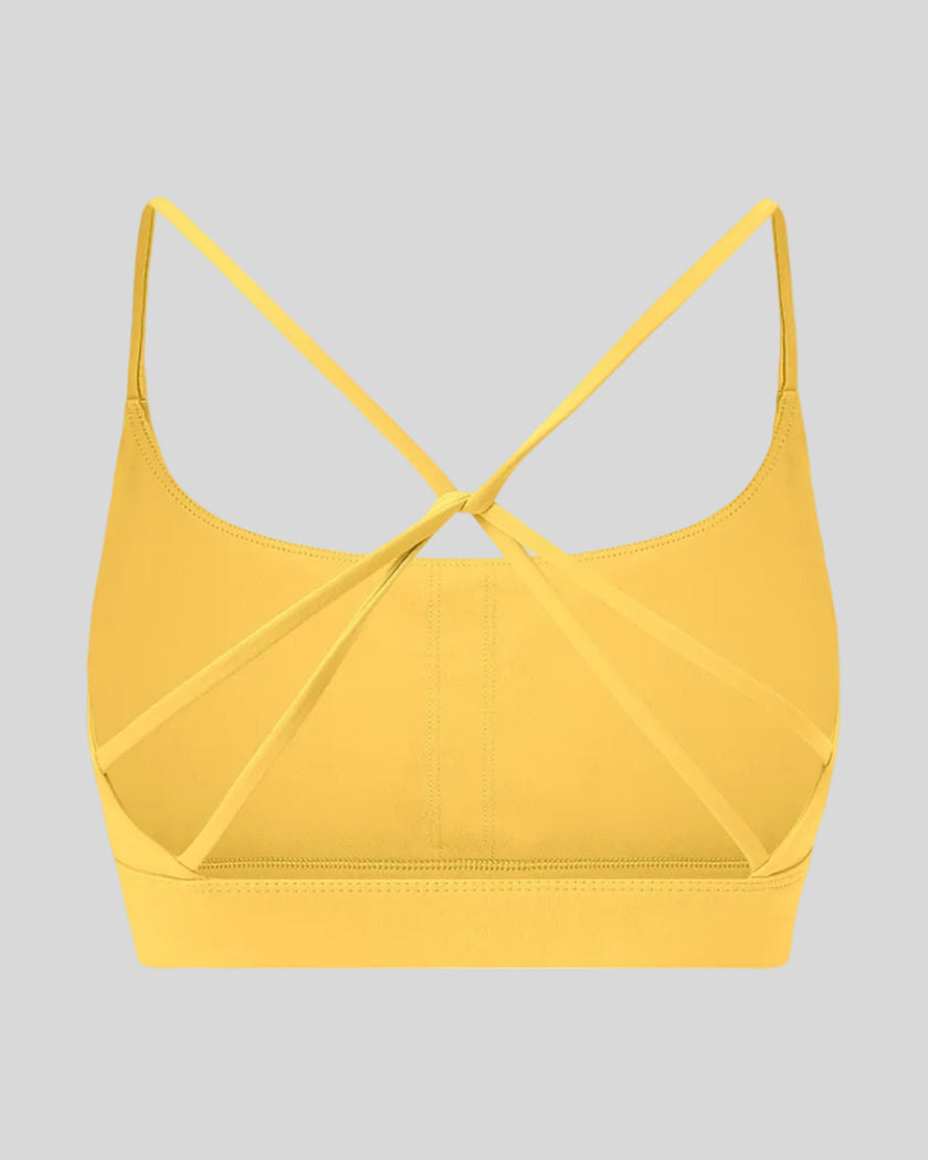 CoreLine Studio Sports Bra in yellow, 3D back view with strappy design